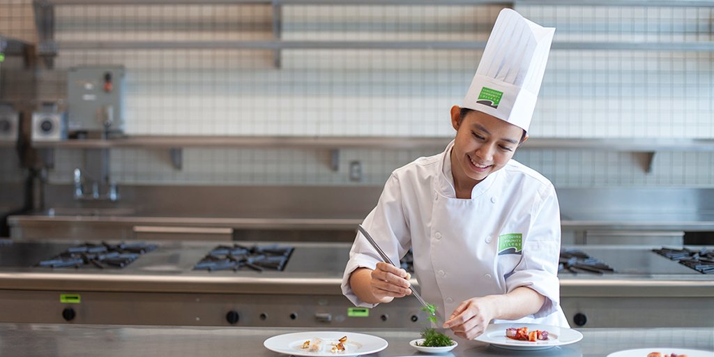 myVCC's tweet photo. As an international student in @VCCCulinaryArts Vanvisa found the courage to cook after a traditional bachelor's degree. Through hard work, passion &amp; positivity, she won an award, featured in the #VCCeffect &amp; was valedictorian for the #VCCGrads '21: https://t.co/nz4Y8ziUfl #myVCC https://t.co/CzG3cOWIy9