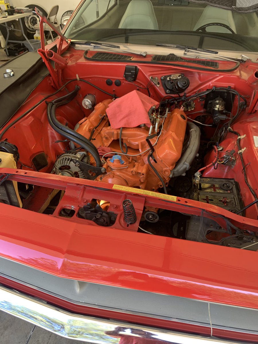 Zirus01's tweet photo. She’s closer to being back on road this weekend. Engine and trans are rebuilt and back in. Finished up new trans lines, fuel lines and gauges today. #70Cuda https://t.co/stcgyIUYbq