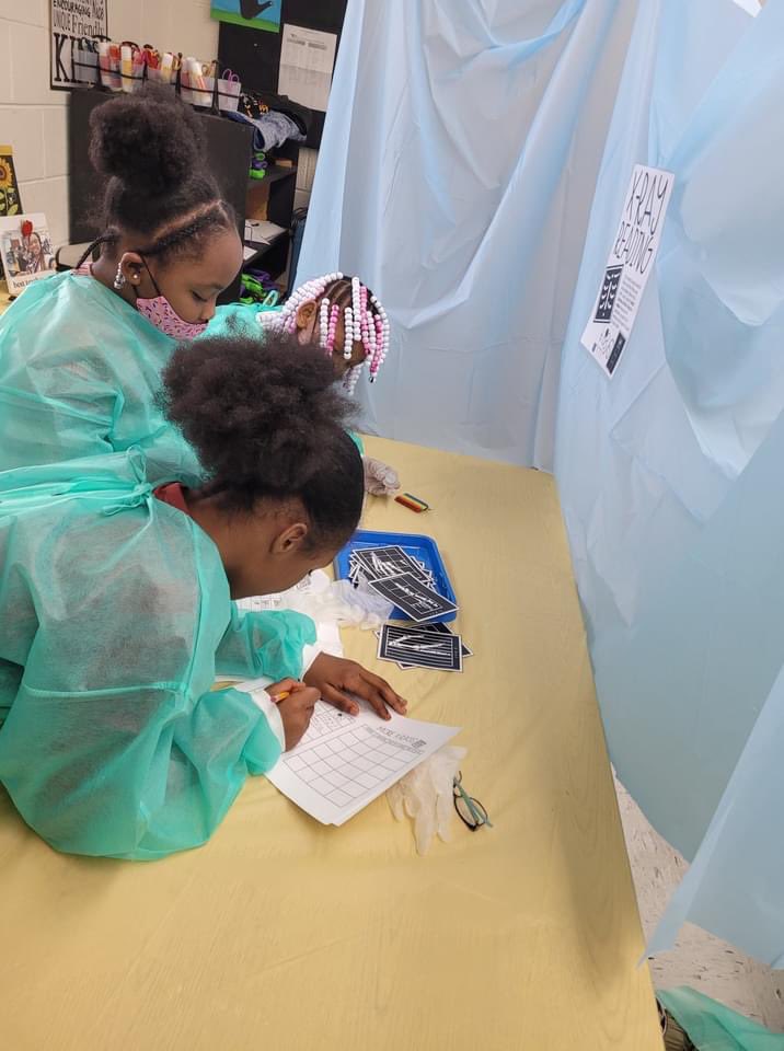 VanceCoSchools's tweet photo. Students @EMRollinsSTEAM1 applied what they learned about fractions.These fraction doctors visited 4 rooms, each w/ fraction related tasks:X-Ray, Surgery, Medical Charts &amp; ER! Lab coats were provided by a school partner for this innovative experience for Ms. Watkin's 3rd graders. https://t.co/vsqgLSg4b3