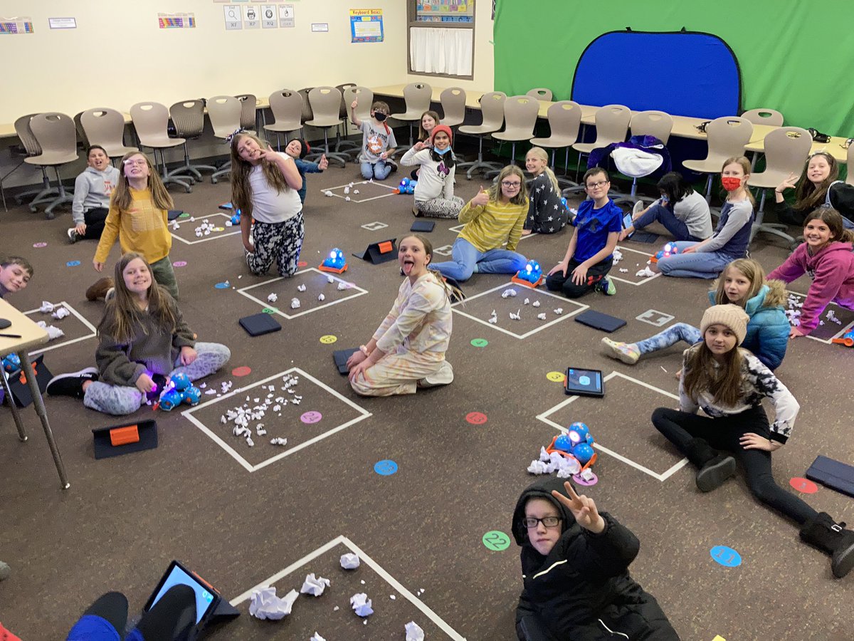 4th grade Robotics Club programming Dash to clear snow from their “driveways.”