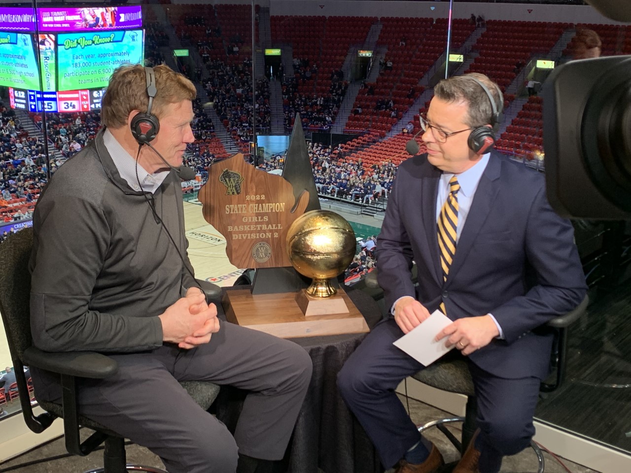 Mark Murphy speaks with Scott Emerich during the WIAA Girls State Basketball Tournament.