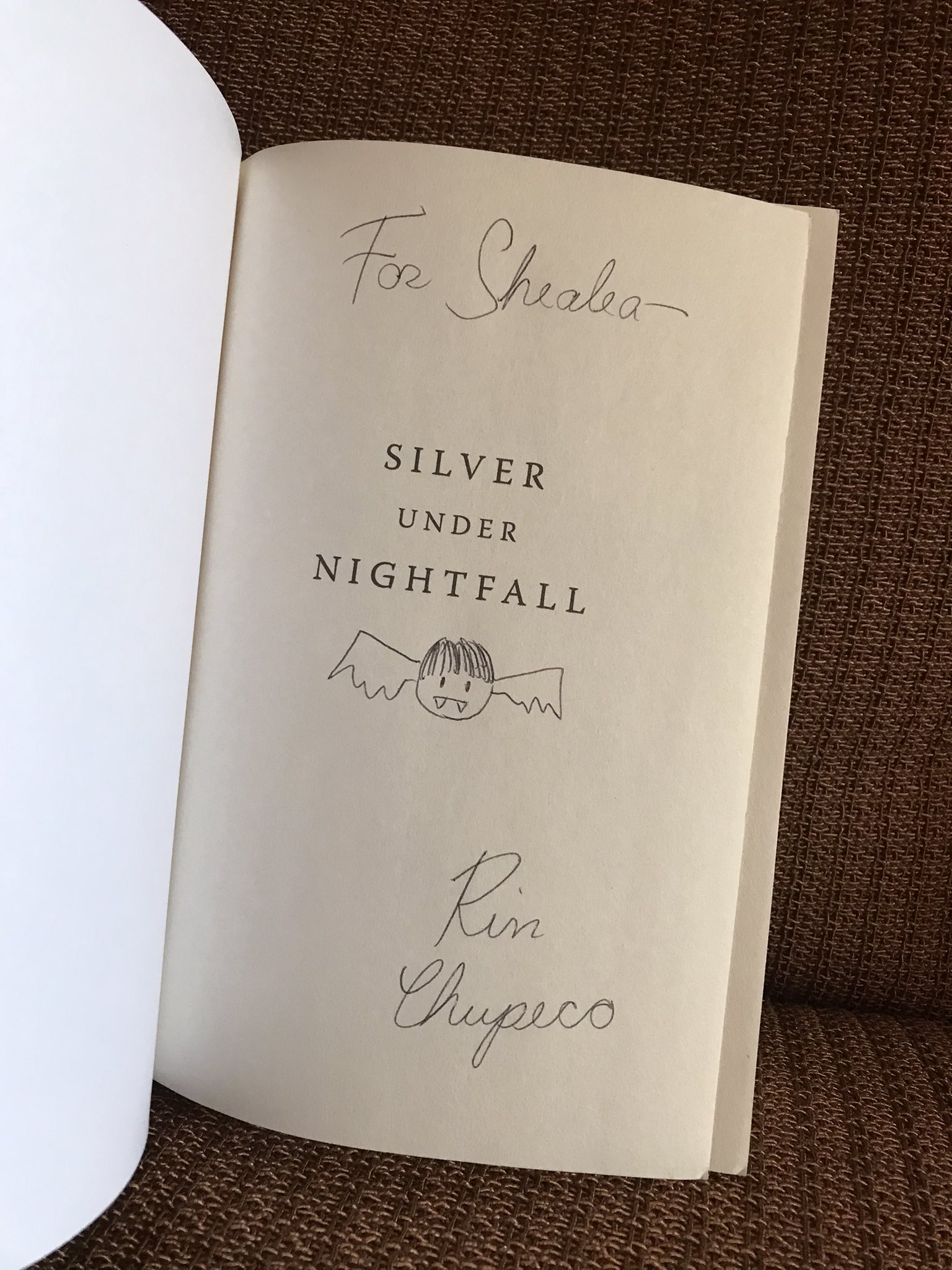 Image displaying signed title page of Silver Under Nightfall ARC, addressed to Shealea of Shut up, Shealea