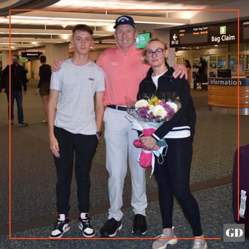 GolfDigest's tweet photo. Mykhailo “Misha” Golod and his mother Vita were greeted at the Orlando International Airport by @DavidLeadbetter on Friday night.