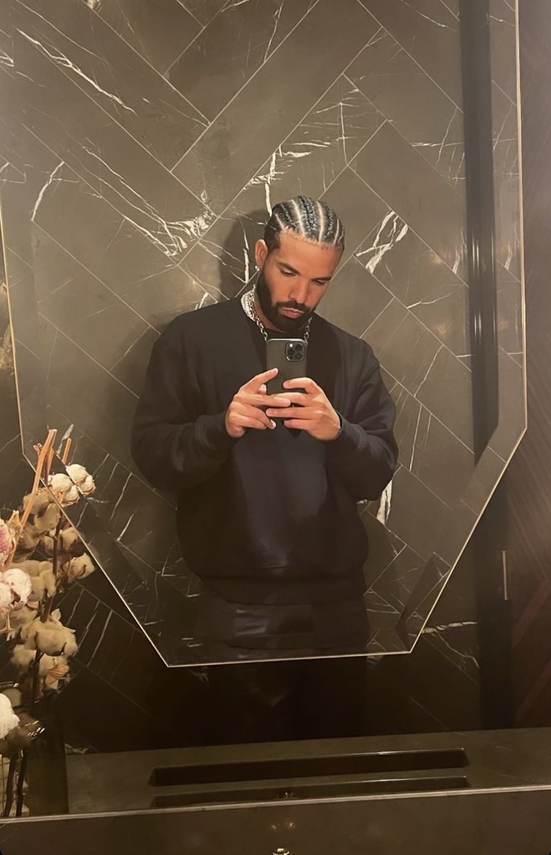 XXL's tweet image. Drake shows off his new hairstyle