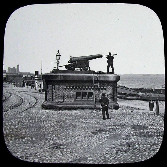 The One O'clock Gun, Morpeth Dock, Birkenhead.  From 1867 this gun fired each day at 1pm for ships to set their clocks by.  Its boom could be heard for miles around and tradition says if you were born within hearing distance of the One O'clock Gun you were a true Scouser.