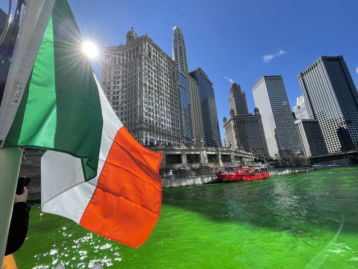In the city of Chicago the sun is shining, the flag is flying, and the river is again a proud vibrant green