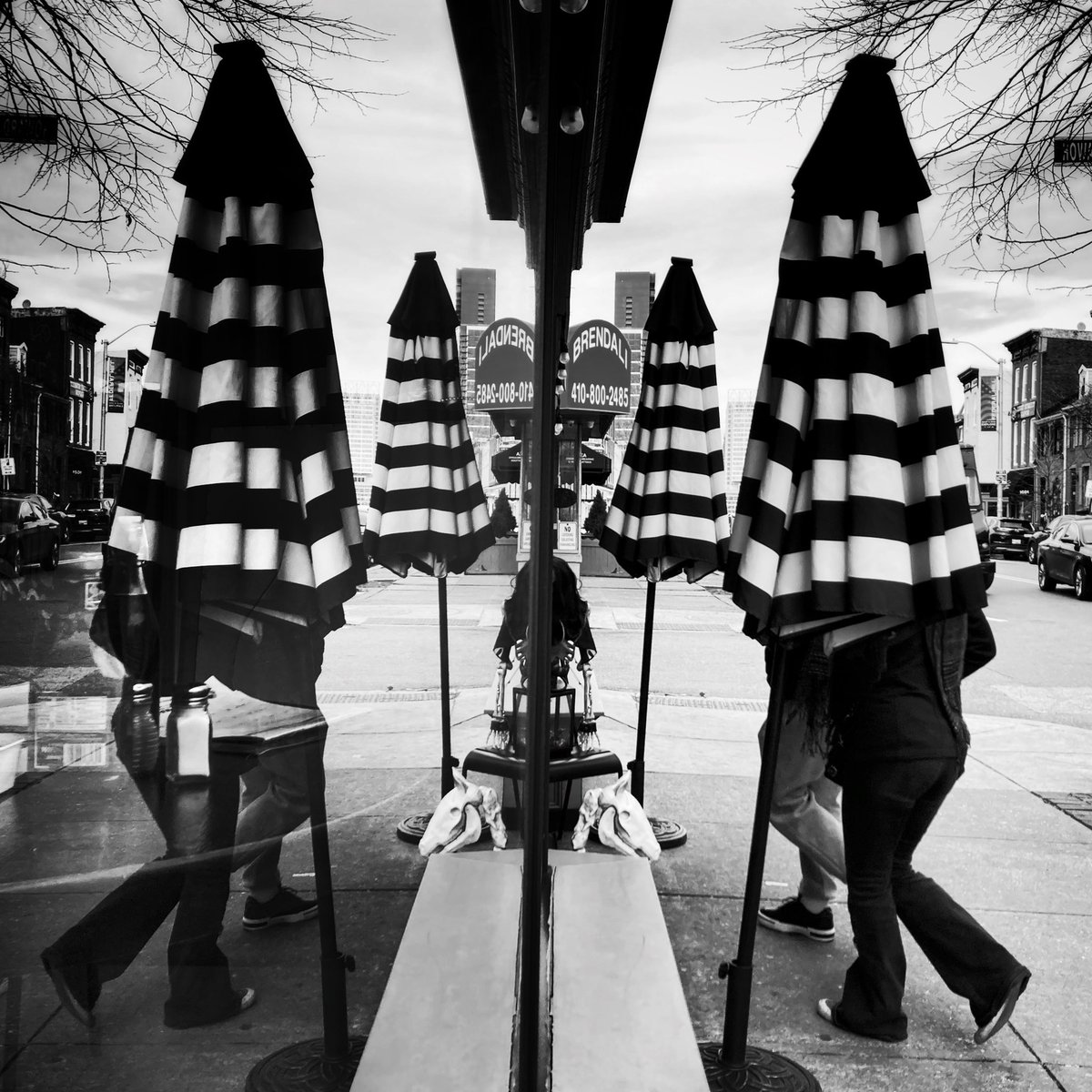 Taking cover. 
#streetphotography #baltimore #blackandwhite