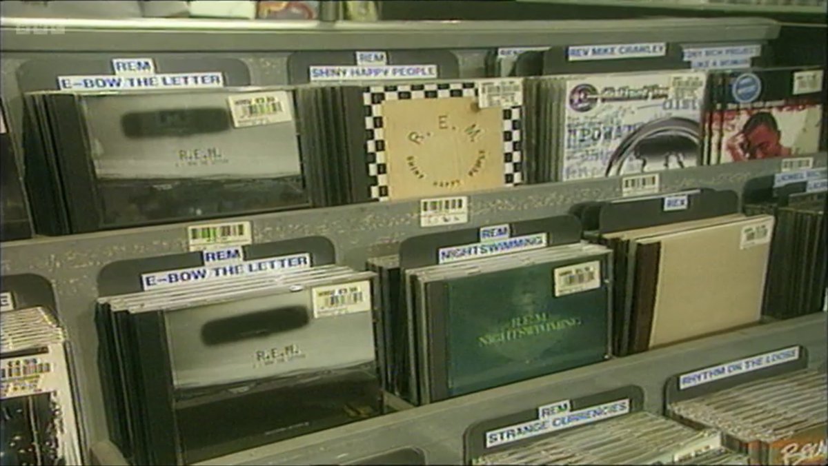 pearceyp78's tweet photo. Mega nostalgia pang. This just flashed up during #REMatTheBBC #hmv header boards, kroy machines, removing the old glue till your fingers bled, red kroy for sales, CD singles. Also looks like this store had a recent stock count from the shelf labels. 😂❤️#GoodTimes #Nipper #90s https://t.co/GfmZ76oFU2