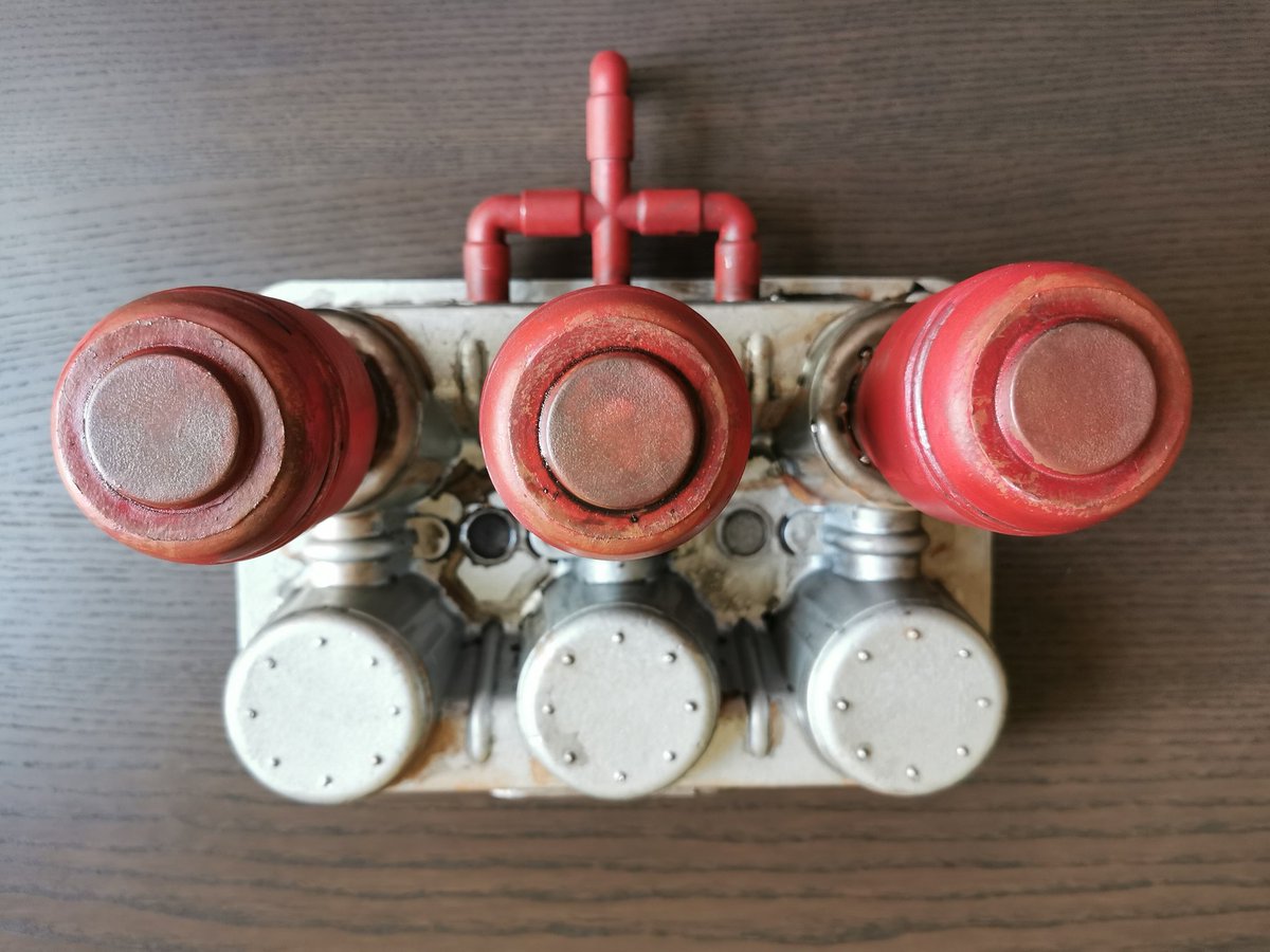 Houruck's tweet photo. I am almost done with this oil refinery themed piece. I still want to paint some numbers on them with a stencil and apply some sand. It is made out of sour cream packaging and cat milk bottles. #tabletop #wargaming #junkbash https://t.co/XKpbHbGaoa