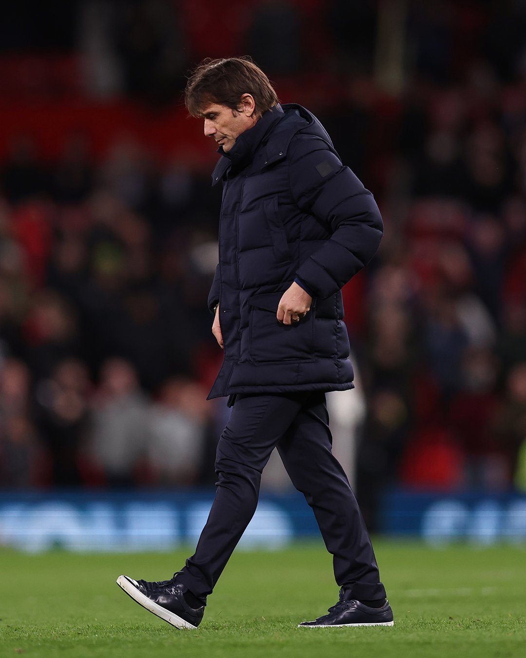 Antonio Conte looks dejected after full-time at Old Trafford