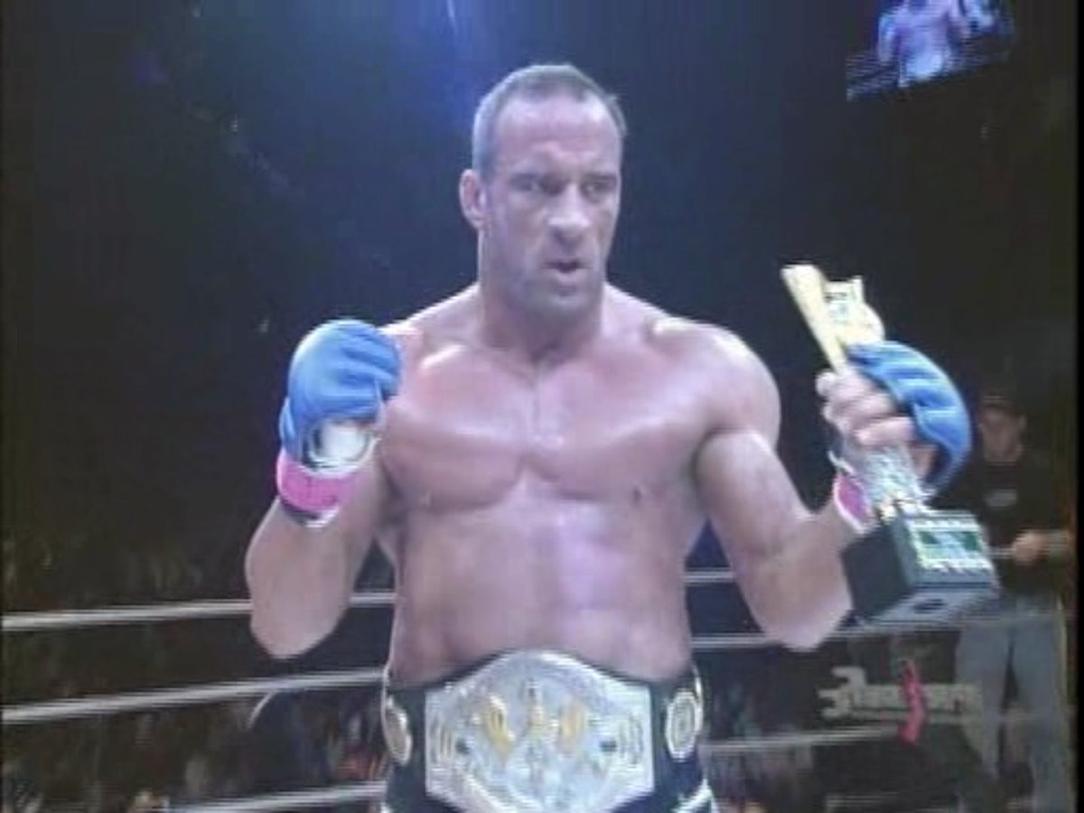 Antonio Inoki presenting Mark Coleman with the WWF World Martial Arts championship following Coleman's KO win at PRIDE 13 on March 25, 2001. 

Inoki won the title for the first time in 1978 and held it until 1989 for a combined 4,000 days. Looks pretty good on Coleman, though!