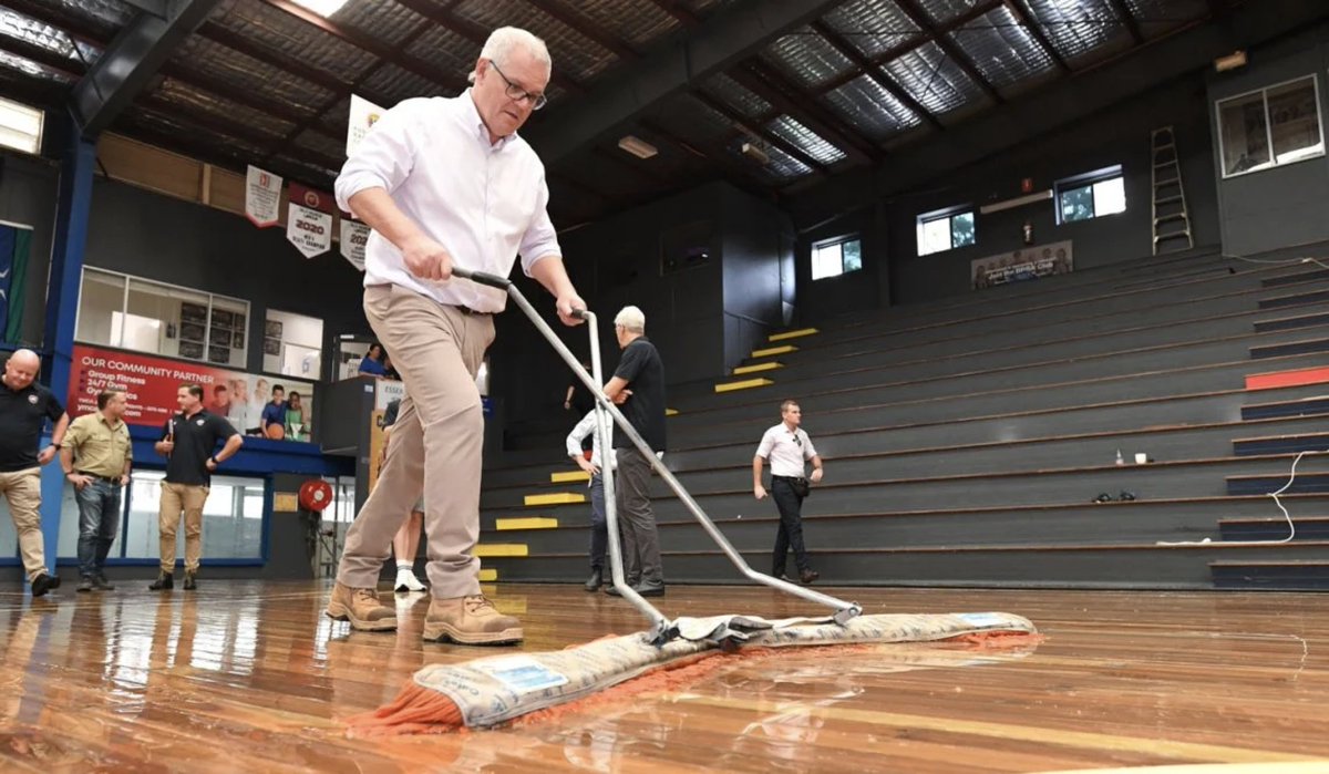 PRIME MINISTER Scott Morrison with a Mop.  The Mop is on the right.