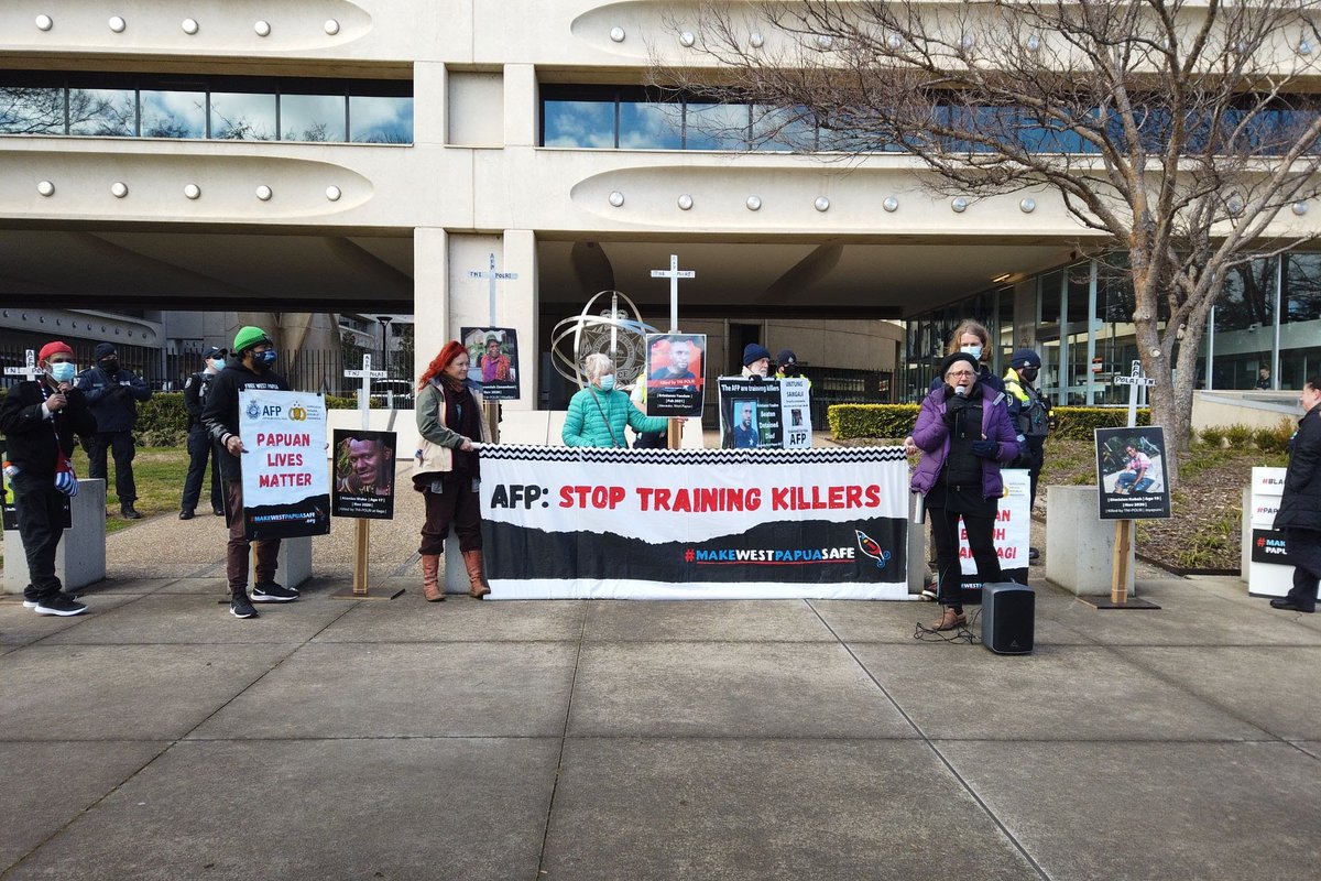 peace1npapua's tweet photo. MWPS held a rally outside the AFP HQ in Canberra in memory of Kristian Yandun. The training of Indonesian police by AFP at JCLEC in Java includes human rights abusers like Untung Sangaji. #StopTrainingKillers #PapuanLivesMatter See the action here: https://t.co/bOZvezgqpf https://t.co/j4IdlwTBcA