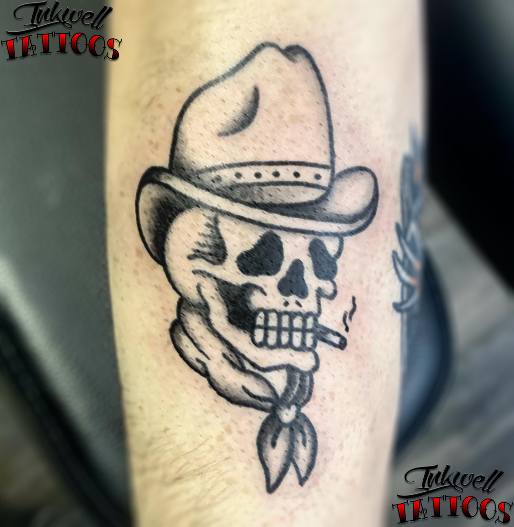 addison The skull of a skeleton wearing a cowboy hat