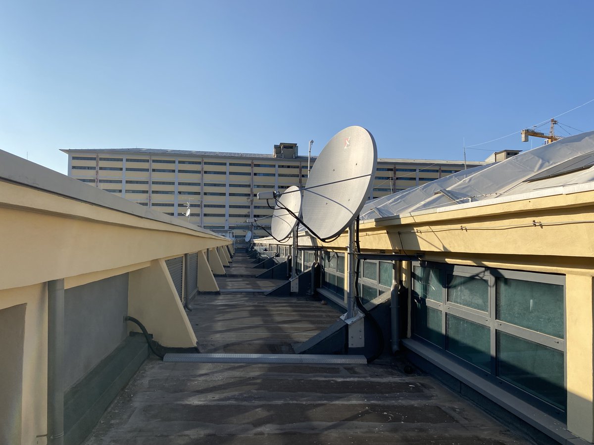 stuartdmitchell's tweet photo. On the roof of the @ECMWF Tecnopolo in Bologna, inspecting the #EUMETCAST reception antennas - part of our important data acquisition from @eumetsat https://t.co/Wfwbn7vLvv