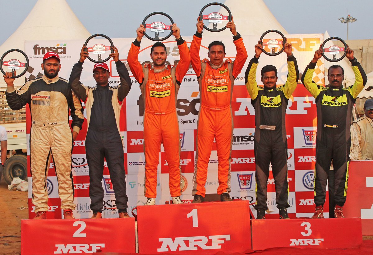 .<a href="/Gillracing/">Gaurav Gill</a> and <a href="/Musasherif/">Musa Sherif</a> (centre), Overall winners of #K1000Rally, Round 2 of the #FMSCI Indian National Rally Championship 2021, Associate sponsor #MRFTyres flanked by second-placed #YounusIlyas and #AnirudhaRanganekar (left) and third-placed #FabidAhmir and #SanathG.