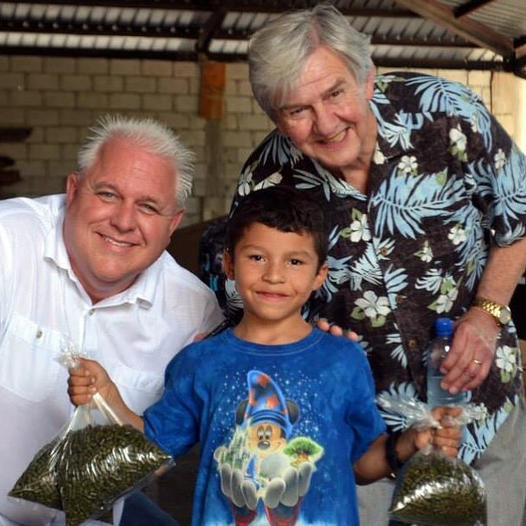 Here is a happy boy with two bags of cereal grass pellets for his family in the mountains of Guatemala.
We have provided over ten million servings of Pines Wheat Grass and other greens to impoverished people in Africa, Central America, and the United States during our 46 years.