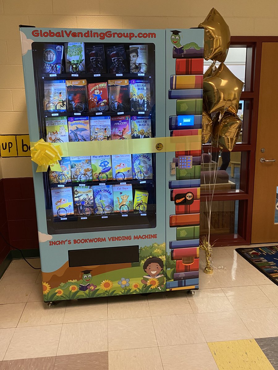 Rovezingram's tweet photo. Today we unveiled our new mural done by @HamiltonGlass! Also, we unveiled our newly framed picture of Mrs. Marguerite Christian and her bio! And you know we had to surprise our little lions with a book vending machine! It was LIT 🔥@MChristian_ES today! #PowerofthePride https://t.co/JsfTZAcXgS