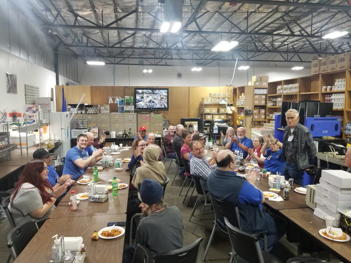 ComputerCorpsNV's tweet image. Volunteers 9 to 90! George is celebrated on his 90th Birthday with cake and a lunch. George (standing) has contributed more than 4,500 hours to ComputerCorps.