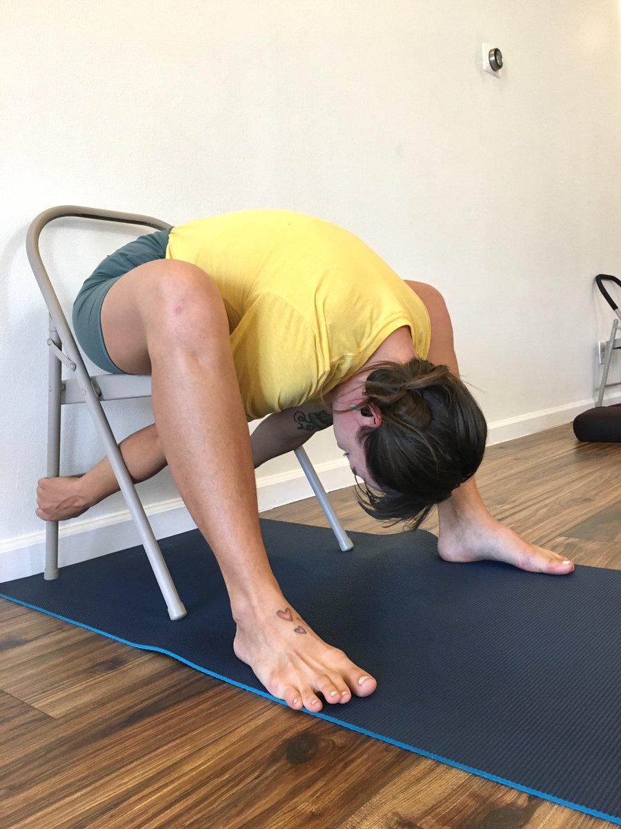 Melissa taught Kurmasana prep with a chair today; first phase/pic elongates the spine; second phase/pic rounds the back. Thanks to Melissa Lorraine Hagen-Wilson for the first pic! #IyengarYoga #YogaWithProps #Kurmasana