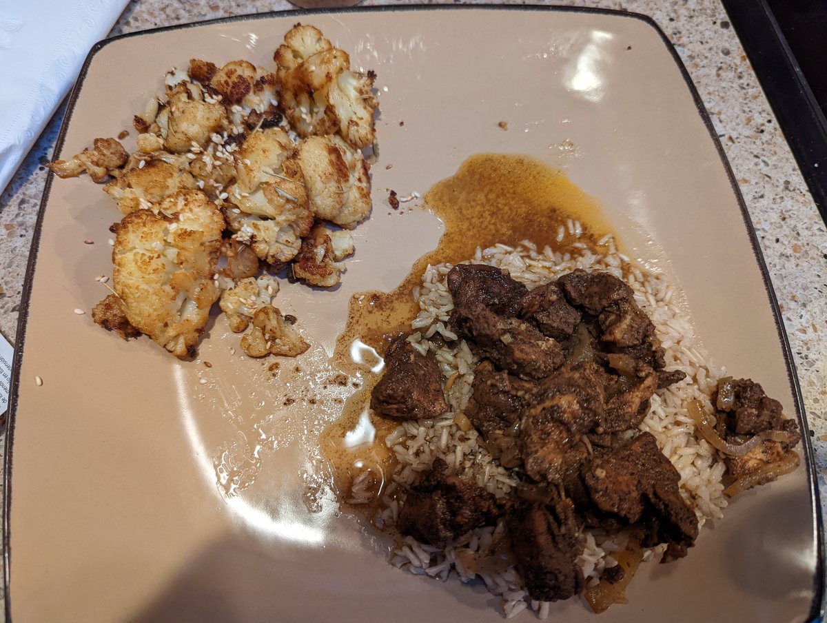 SethJMeyer's tweet photo. Tonight's dinner: Sri Lankan brown curry over spiced brown rice and peri-peri roasted cauliflower topped with roasted sesame seeds. https://t.co/oBUvd7MMhN