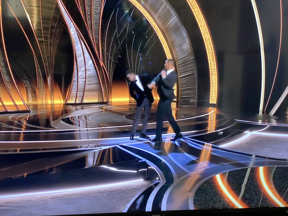NancyAHoch's tweet photo. So Will Smith laughed at the joke and then chose to assault Chris Rock on live tv. So how is he still sitting in the audience?? How did security not remove him?? #Oscars https://t.co/o49MSHXpqX