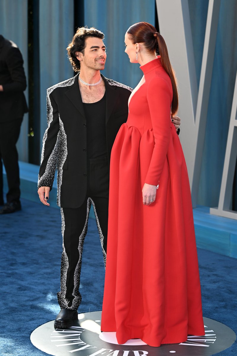 enews's tweet photo. Speechless, over the edge, we're just breathless. Joe Jonas, Sophie Turner, and their future love bug arrive at the Vanity Fair #Oscars party. (📷 : Getty) https://t.co/lH1BGp7IML