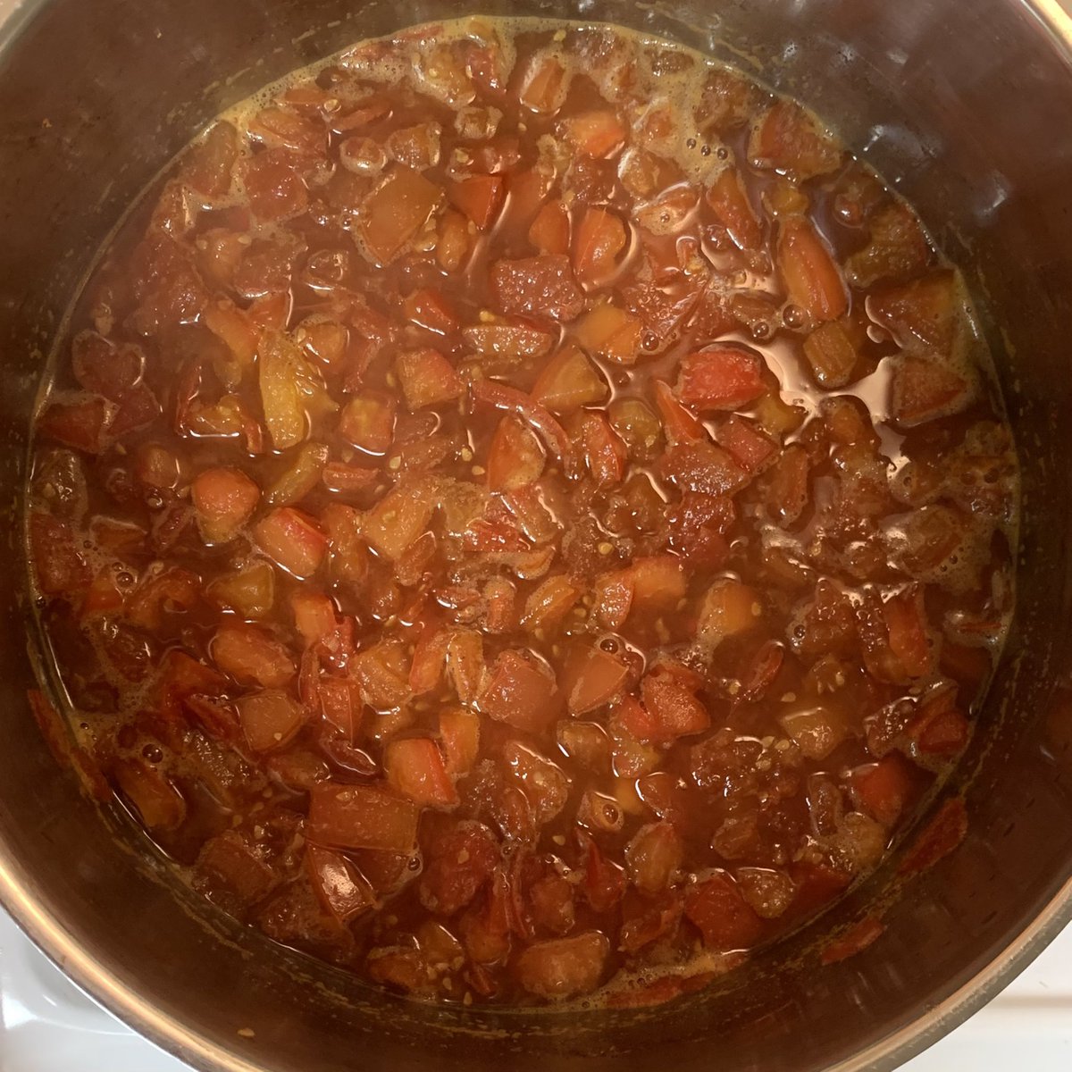 canadachandra's tweet photo. The simmer is on! It smells AMAZING in my apartment right now. Cloves, cinnamon, and ginger = yum!
Next time I’ll remember to wear gloves when dicing 8lbs of tomatoes. My hands are feeling the burn! Ouch!
#tomatojam #homecooking #tomato #homemade #chancancook #yummy https://t.co/0PjEciorNG