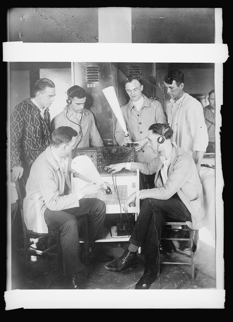 Disabled veterans at the Drexel Boulevard Hospital in Chicago enjoy news and music on the radio: