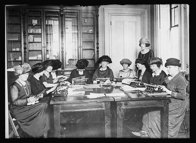 Women at the American Red Cross Chapter of New York transcribe popular fiction into braille for blinded veterans: