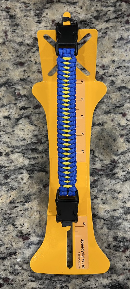 TekMode1's tweet photo. @Kyiv I stand with the people of Ukraine. 

What Putin is doing is unjust and barbaric. Putin is a war criminal. 

I made a paracord bracelet honoring Ukraine. I will wear it thinking and praying for the innocent people of Ukraine. https://t.co/S9pfg2gQzz