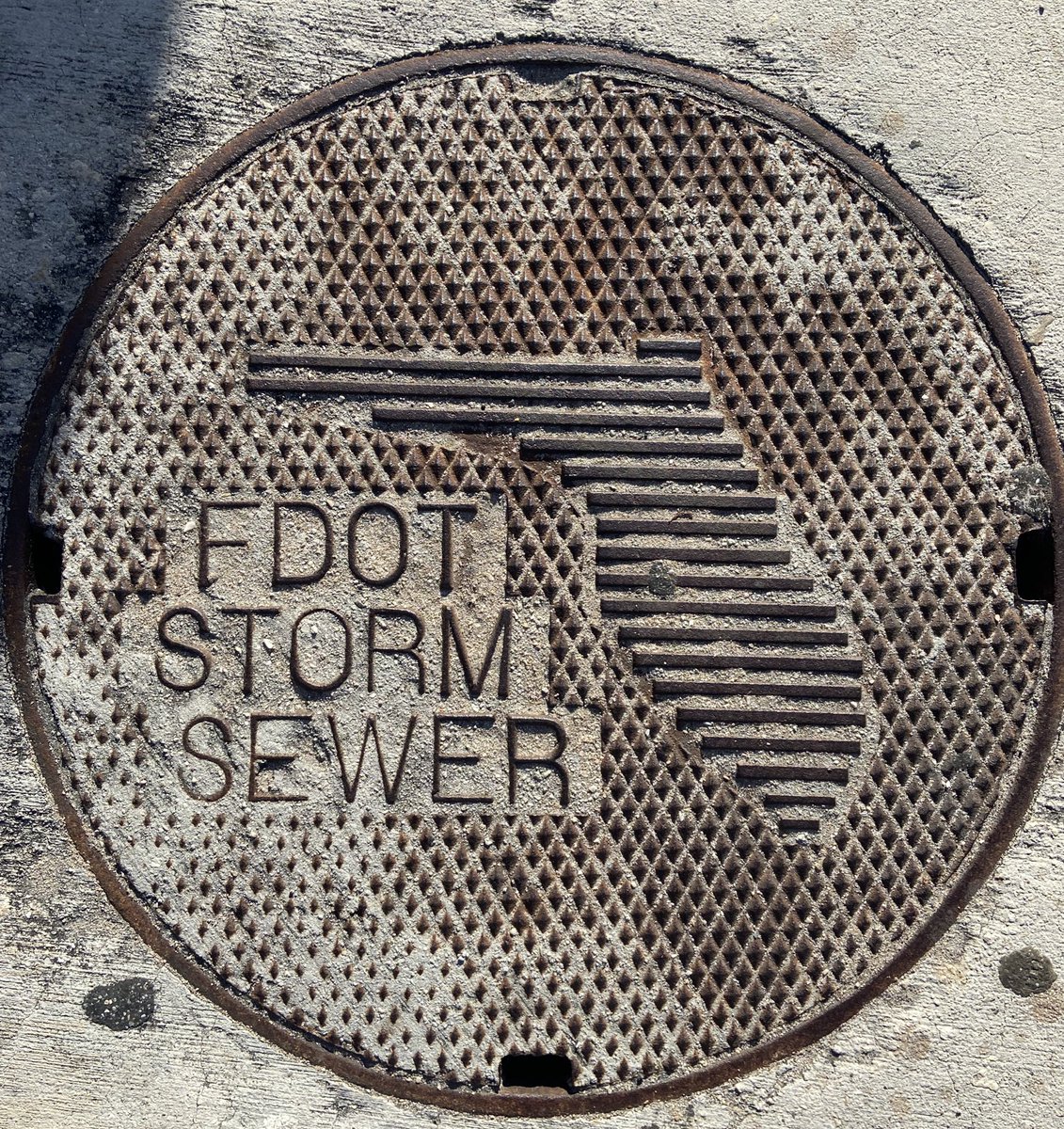 mattmcd43's tweet photo. 80s futuristic design of Florida #manholecovermonday https://t.co/DMNZ7fwpdK