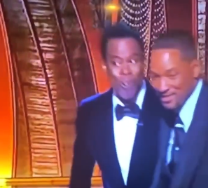 GaiusCa1igu1a's tweet photo. Two men who both appear to be slightly amused following a high profile live 'bitch slap'.🤔 #Staged? #Rehearsed? #OscarsFail https://t.co/UxU3JMs8Li