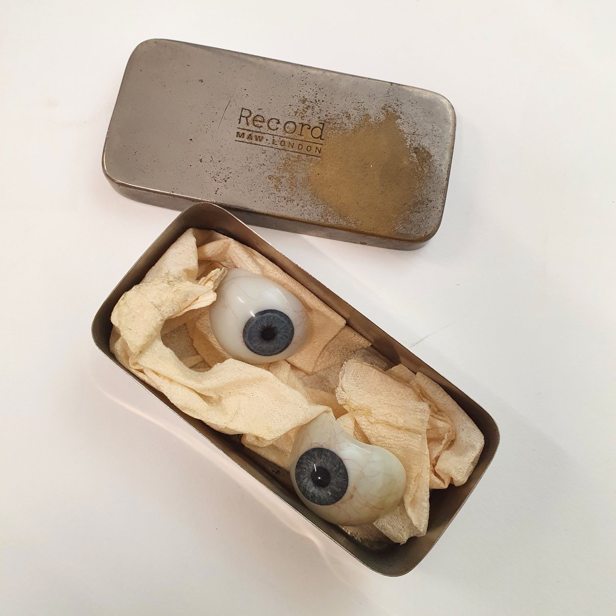 Want to see #SomethingScary? Imagine our surprise on opening this tiny innocent-looking tin which turned out to contain these glass eyes 👀😱 #Archive30 #HistMed #ExploreYourArchive