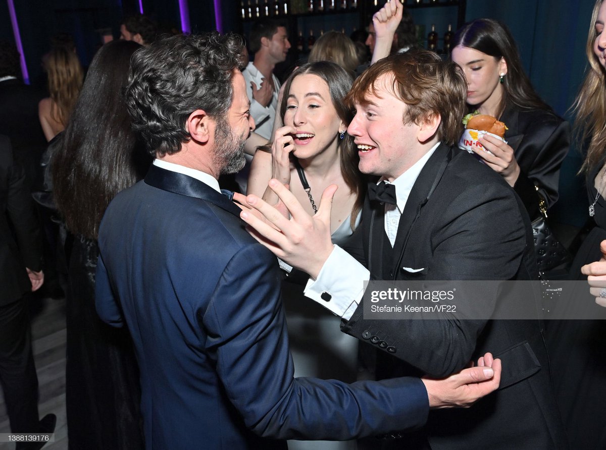 haimsource's tweet photo. Alana Haim with Cooper Hoffman and Nick Kroll at the Vanity Fair #Oscars After Party https://t.co/Lz2slLrE9Q
