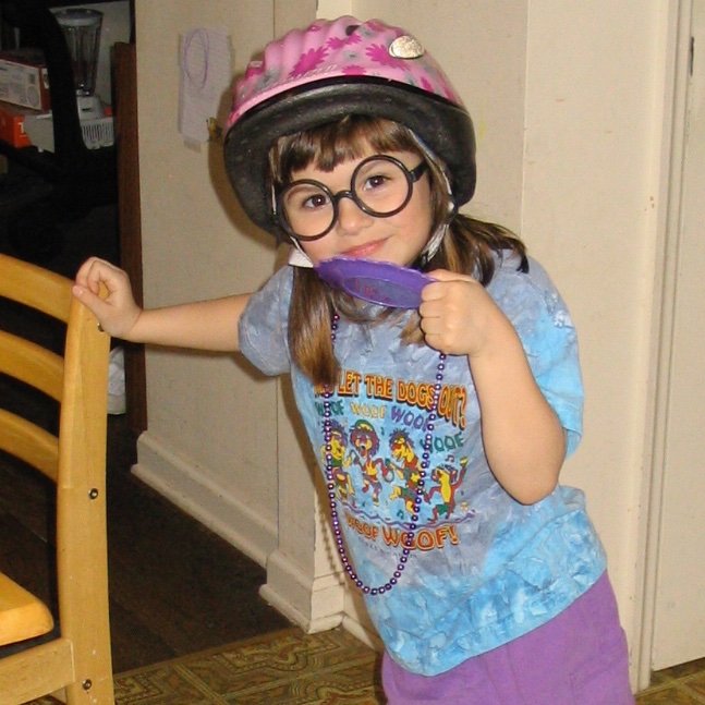 Melissadev22's tweet image. As a child, I always played using object substitution. Today's #flashfact is a #flashback to me pretending I was a librarian. The necklace as a lanyard, the purple disc in my hand as a library card--and I have absolutely no idea what the helmet was for, lol #umassdev2022 #week10