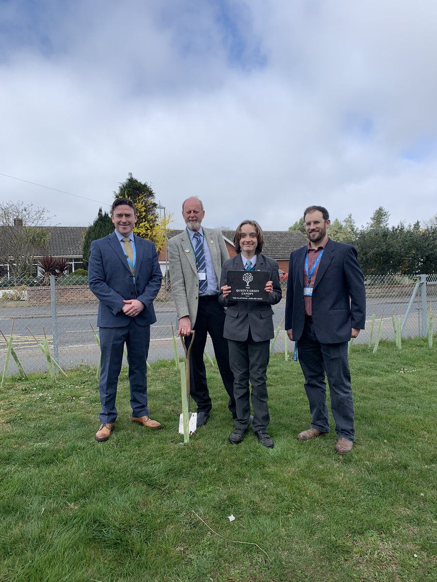 AcademyCromer's tweet photo. Four members of our @EcoSchools committee each planted a tree as part of the @QGCanopy project to commemorate Her Majesty’s Platinum Jubilee. A committee member from each house was chosen to plant the tree which will grow beside their house flag at the front of the school. https://t.co/Ll0J9BL5Cs