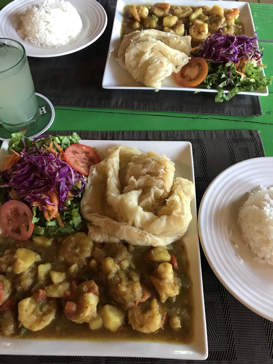 eatsmorefunwk's tweet photo. Great food, great views (esp watching the planes land by the ocean) in the #Caribbean Here’s #roti w/ curried shrimp, the best #oxtail stew I’ve ever had &amp; scrumptious grilled #pigtails #vacation #travel #wanderlust #stmaarten #sxm #cheflife #chefslife #eatamorefunwithkristine https://t.co/U6VrawhKjE