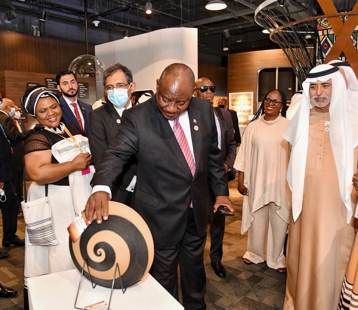 PresidencyZA's tweet photo. [PHOTOS]: His Excellency President @CyrilRamaphosa on a guided tour of the South African Pavillion at the Dubai EXPO Site in the United Arab Emirates. 
 
#SouthAfricaDay #Expo2020Dubai https://t.co/XTuR6aEtpv