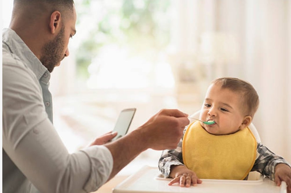 ohmilord's tweet photo. Me feeding my child while keeping up with the latest will smith / chris rock slap memes https://t.co/kOPTjDseoE