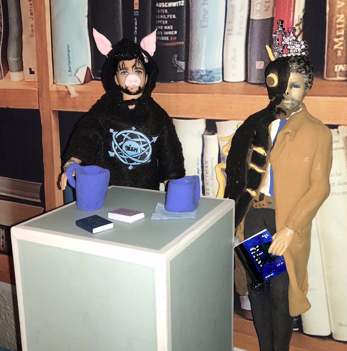 Kimlaray's tweet photo. I’ve been making “action figures/dolls” of the people involved in #GISH. Although a bit twisted, I just had to use @mishacollins and @charliecapen (love you boys)for Item 69 - Kafka's insect having tea with Lord of the Flies. 

#BookBash #GISH #gishbookbash #Item69 https://t.co/8w8fd51wyz