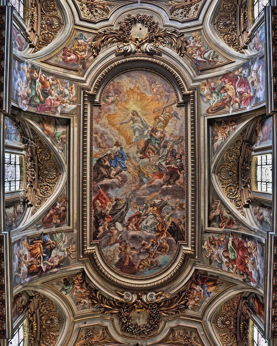 Rome, Church of the Twelve Holy Apostles (1348-1702), the frescoed ceiling of the central nave with the work "Triumph of the Franciscan Order" painted by Giovan Battista Gaulli known as the Baciccio in 1707.