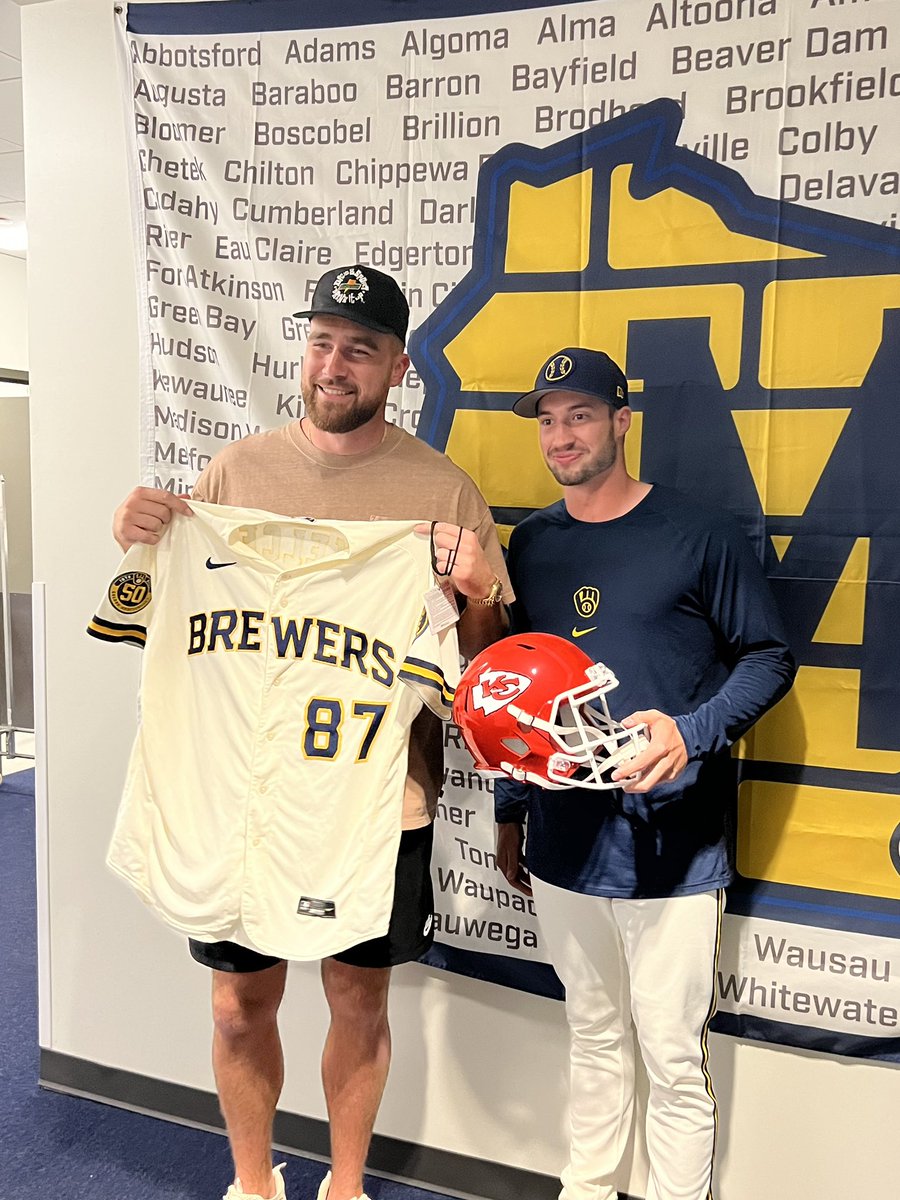 Brewers's tweet photo. One of the NFL’s best pass catchers met up with your favorite Brewers players.

Kansas City Chiefs tight end @tkelce swung by @AmFamFieldsPHX to chat with players before today’s game. https://t.co/WxBwwUeSWl
