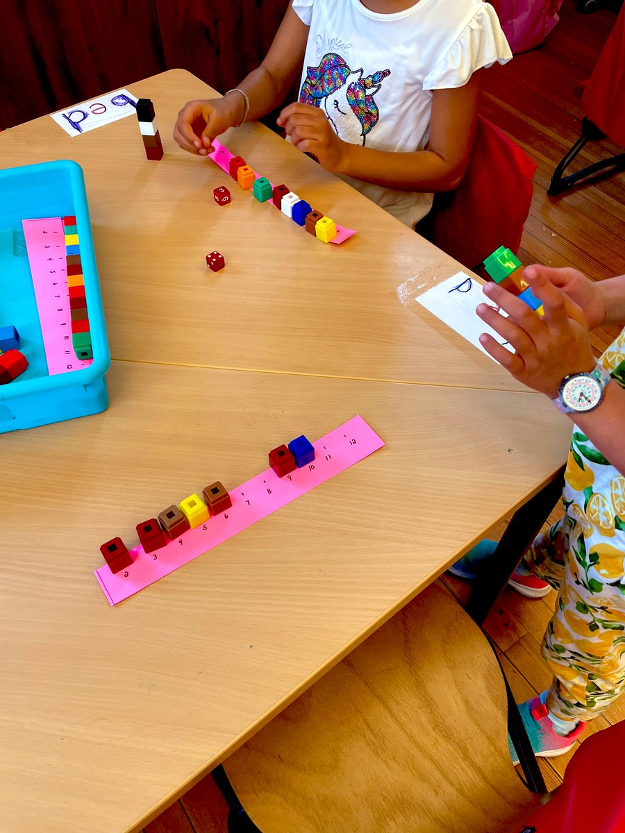 StaceyP1981's tweet photo. What a fun Math game from @mburnsmath - 2 Dice Sums with a class of  #firstgrade students! Best quote of the day - “I was very risky today and put all my cubes on 12!” So fun! https://t.co/OMZSL6jnGQ