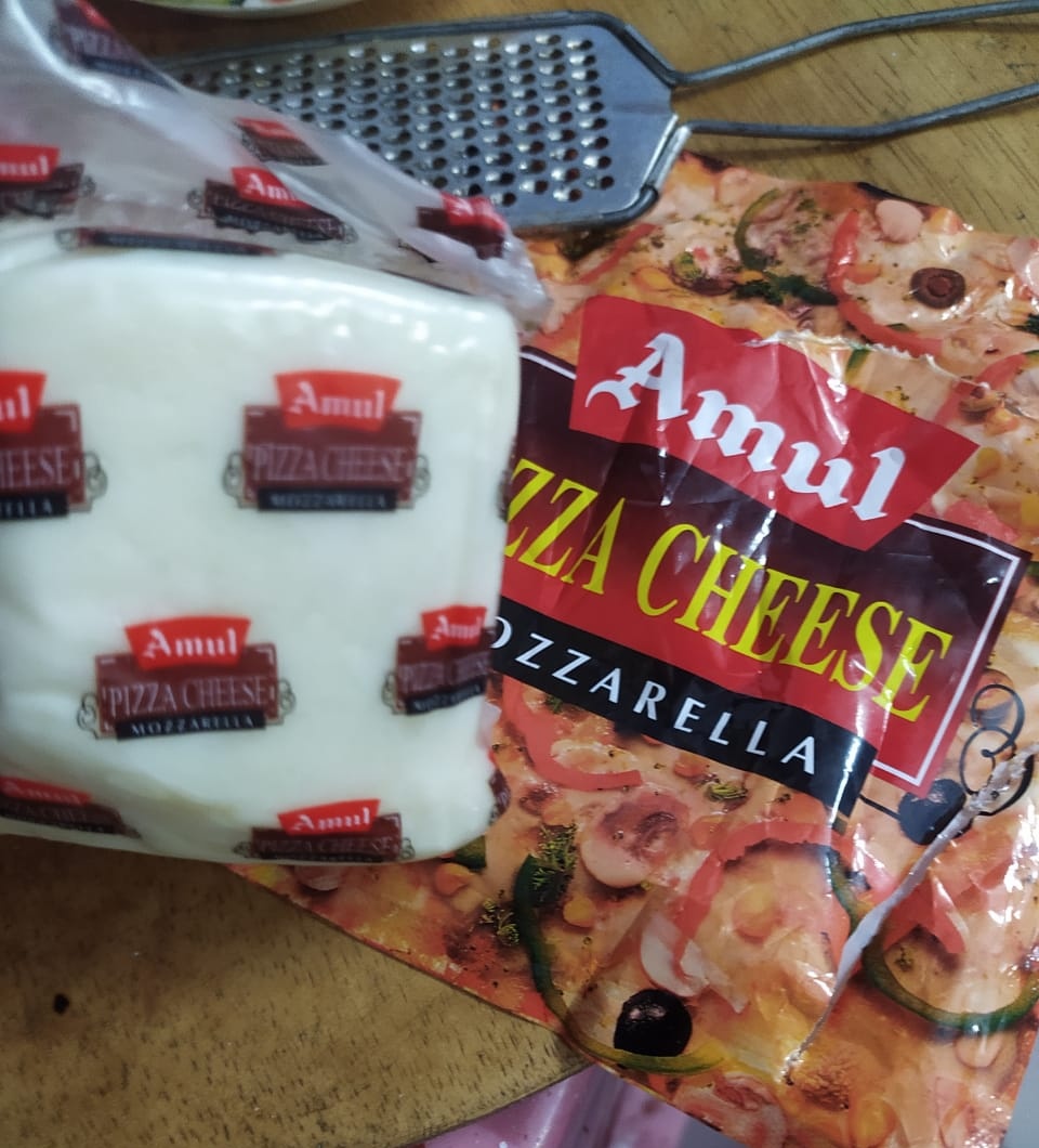 #Amul please take care of your cheese processing unit sanitation and safety.
#Amulcheese When I open the outer layer I saw a hair and some dandruff like substance sticking with it so please take care of it. But amul products are always best 😊😊.