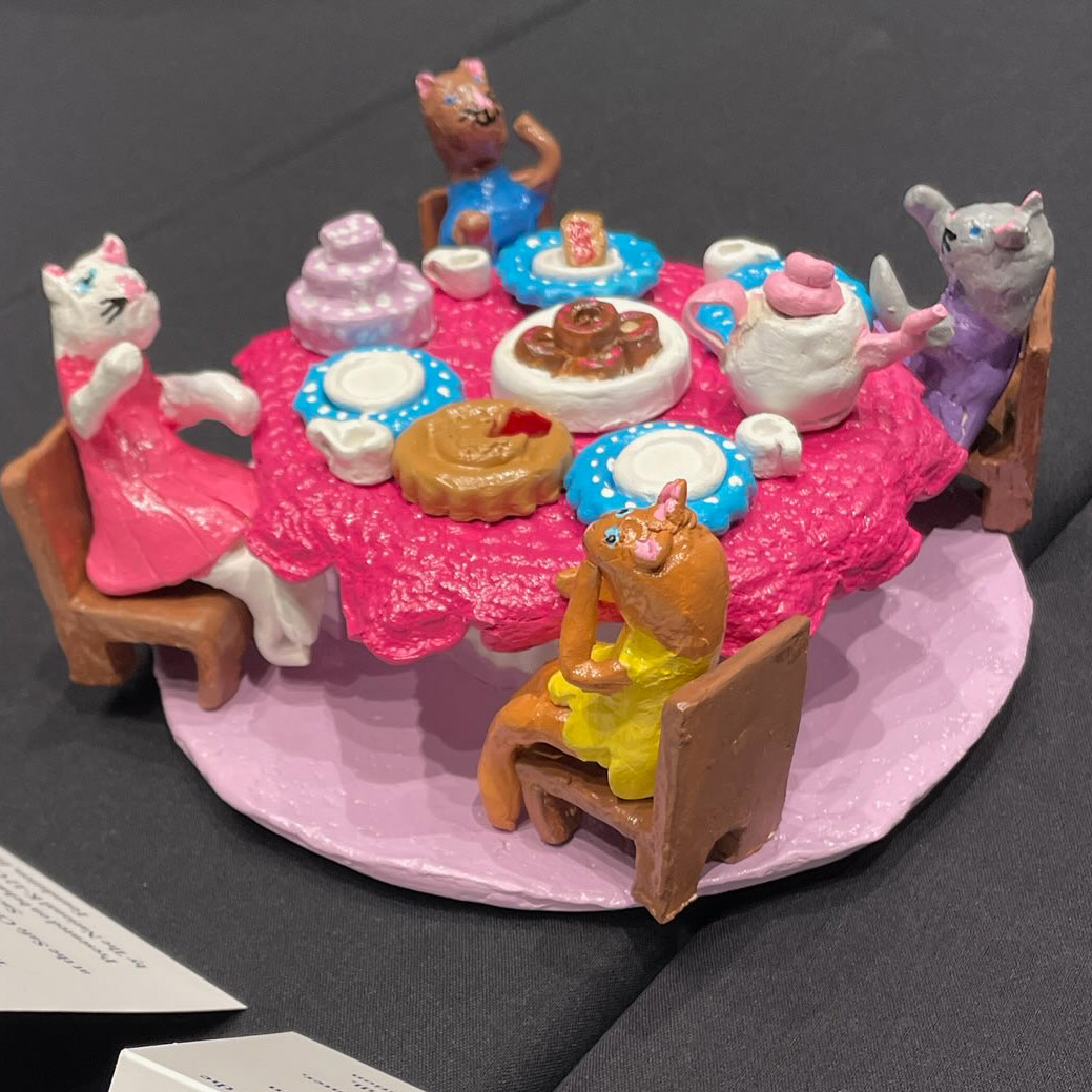 artaxis_org's tweet photo. We are thrilled to announce this year’s recipient of the K-12 Artaxis Award for Excellence, Maya Lokhin! Maya is a 3rd grader from Village Center for the Arts in New Milford, CT. Her instructor is Sharon Kaufman. Maya’s work is titled, “The Purrrrfect Tea Party'' #artaxis #nceca https://t.co/emBJG6T3KK