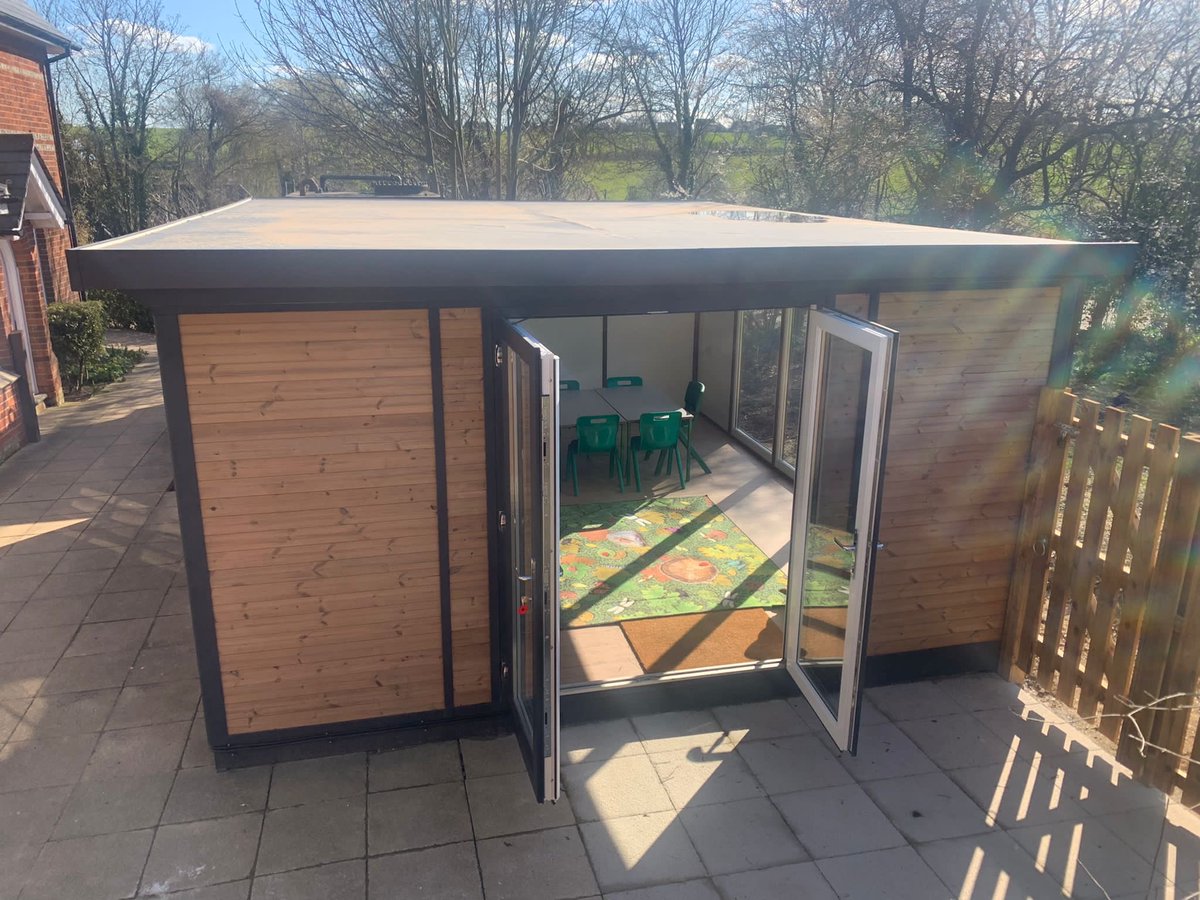 Our library-to-be looked fantastic today in the sun! Shelving starts next week, ready to move books in, but we couldn’t resist using for group work this week. Our official opening date is April 29th. <a href="/SMARTofficeltd/">Smart Garden Offices</a>