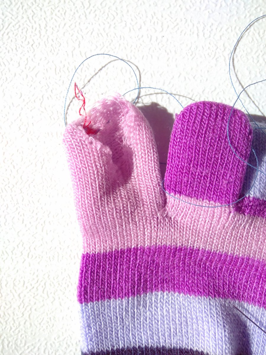 patch_pop's tweet image. Excellent toe-darning in progress. This is an awkward mend, as we haven't had access to a small darning mushroom - a glue stick is doing the job(ish)!