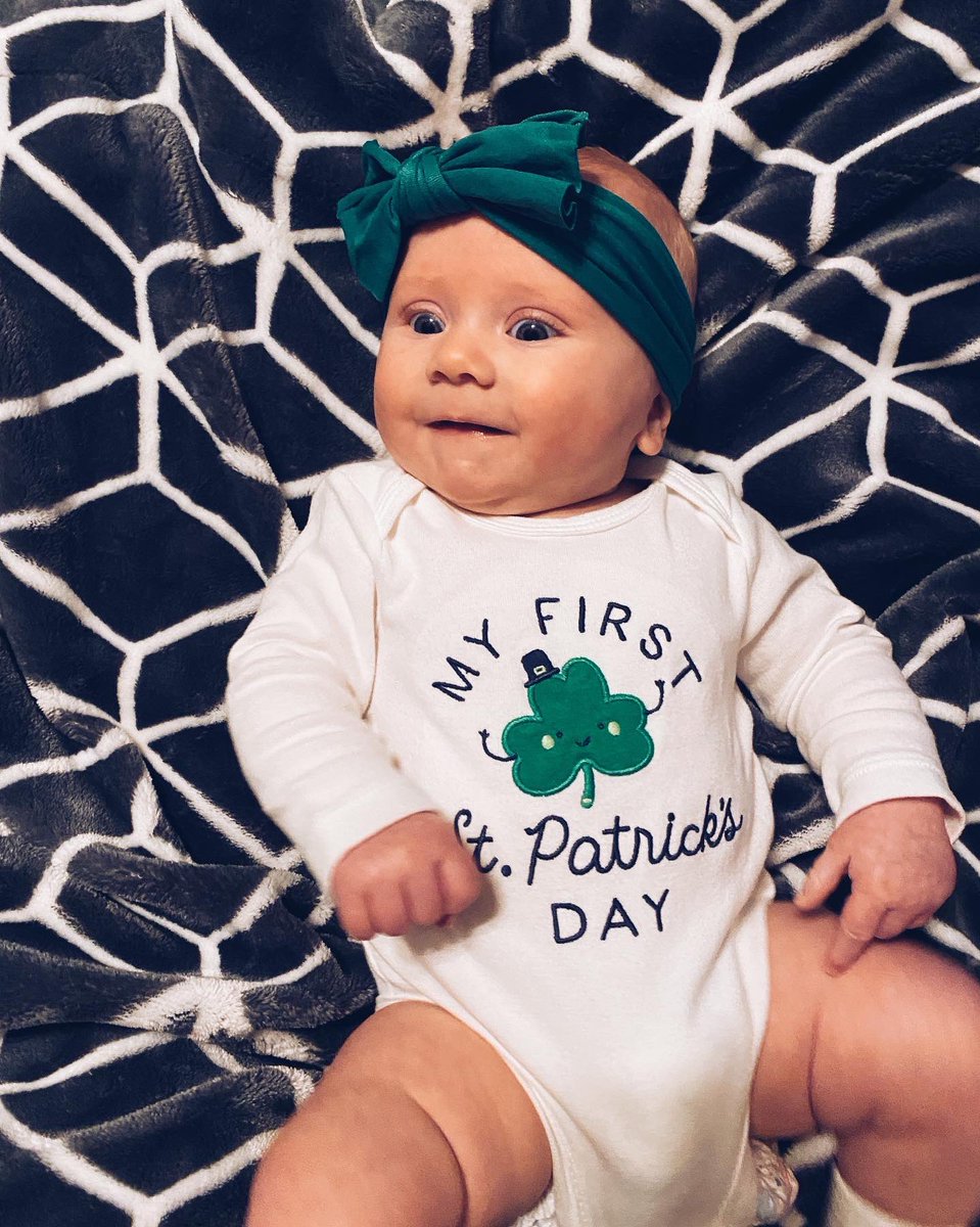 RespectSMGomez's tweet photo. Cam’s first St Patrick’s day! 

0-3 pants are too small, 3-6 are too big so no pants it is! These were the best pics we could get, she was HANGRY. 😂☘️💚 https://t.co/TCpqTfqJTG