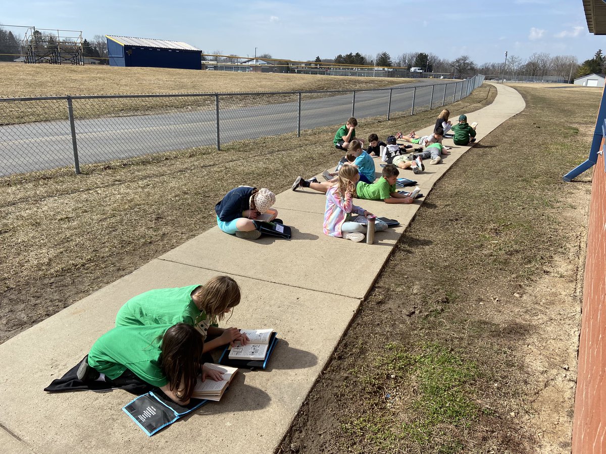 Soaking up some Vitamin D while we practice our reading skills today! ☀️